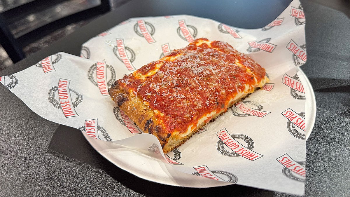 upside down pizza from those guys pies with sauce layered on top of cheese
