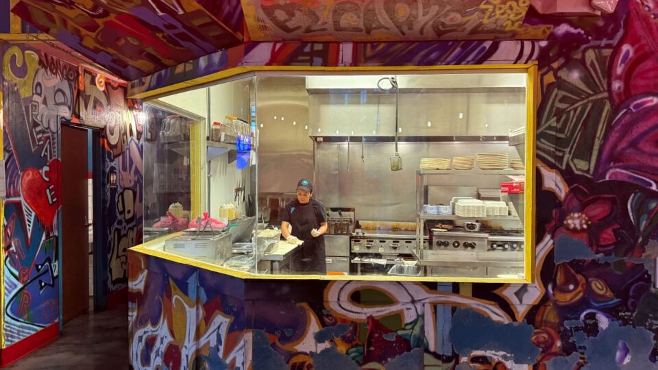 View of the open kitchen area inside Pinches Tacos in Southwest Las Vegas.