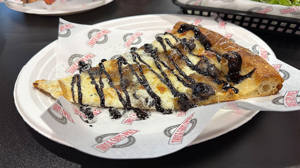 white sauce pizza with caramelized onions mushrooms and balsamic glaze at those guys pies
