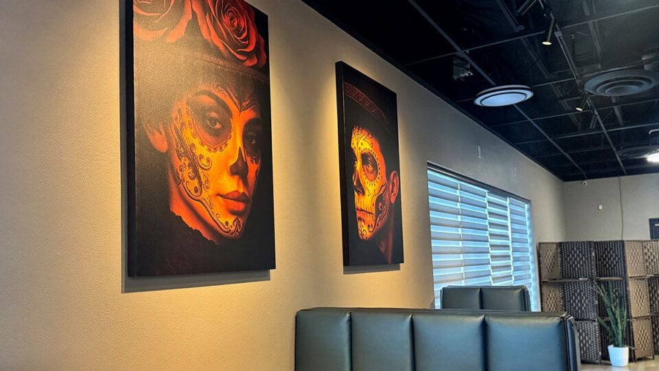 Colorful Día de los Muertos wall art inside Ta’Chingón Flavors of Mexico.