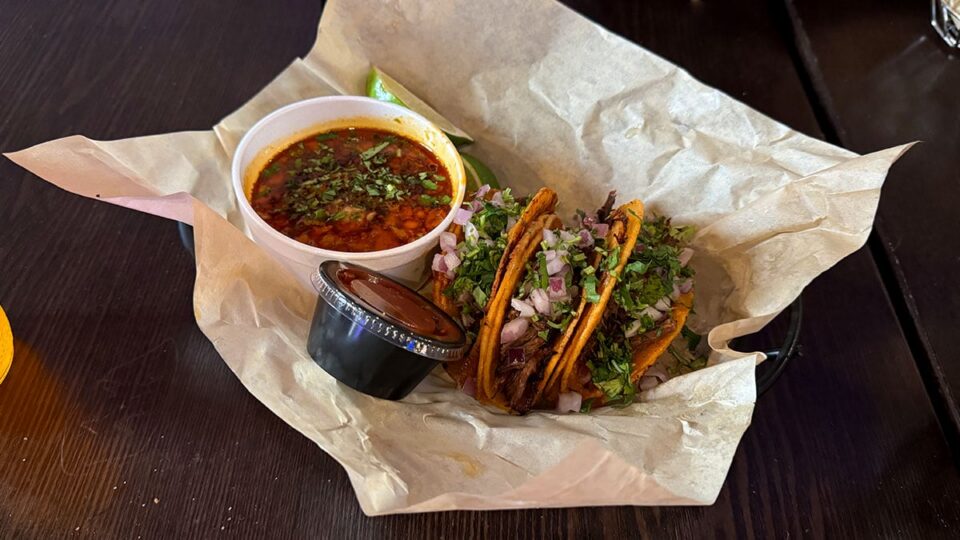 Three quesabirria tacos served with house consommé at Dirt Dog Southwest.