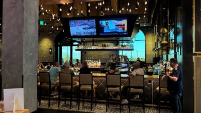 full-service bar at 90 NINETY Bar + Grill featuring cocktails, beer, and spirits