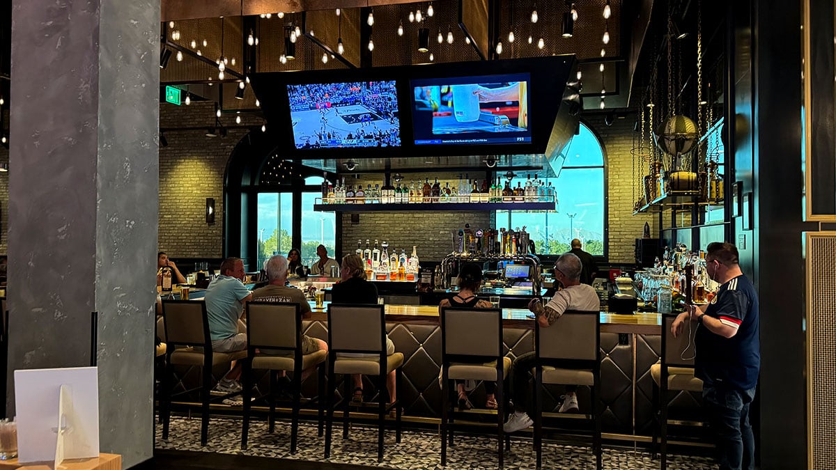 full-service bar at 90 NINETY Bar + Grill featuring cocktails, beer, and spirits