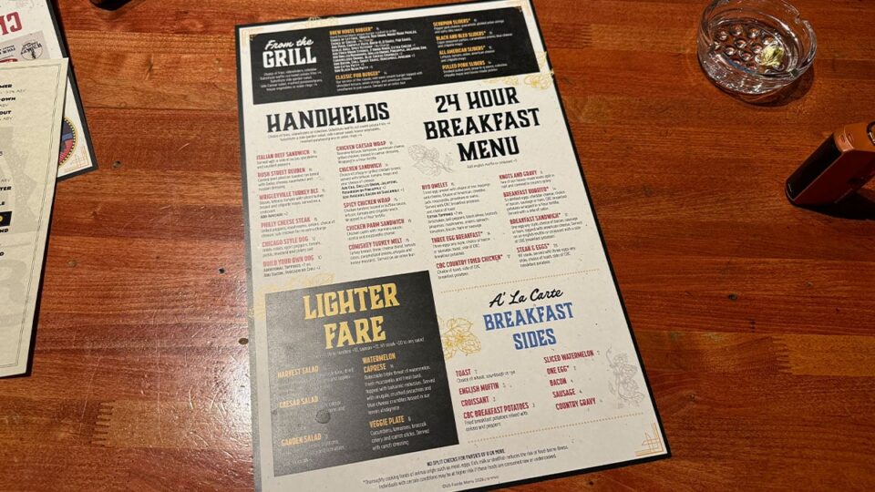 Food and drink menu displayed inside Chicago Brewing Company on Fort Apache in Las Vegas.