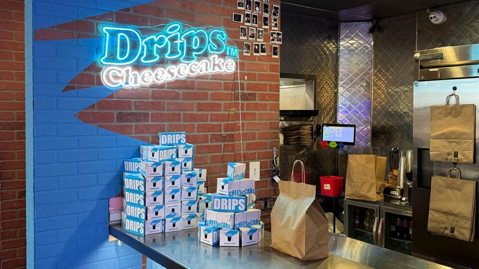 Drip cheesecakes displayed at the counter for dessert at Dirt Dog Southwest.