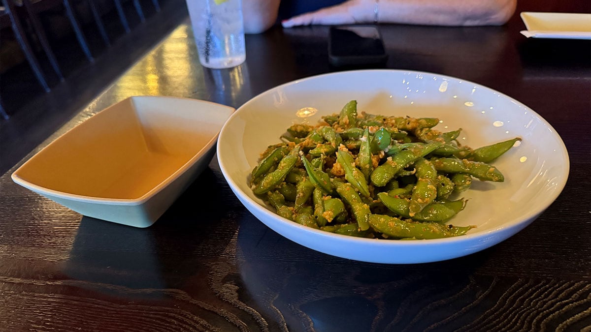 Garlic edamame appetizer served warm at Sushi Loca.