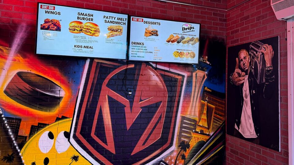 Golden Knights mural under the menu with Eminem wall art inside Dirt Dog Southwest.
