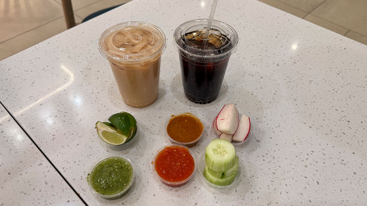 horchata drink served alongside a selection of fresh salsas at Tacos 1986