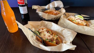 Hot dog spread with loaded fries and tacos at Dirt Dog Southwest.