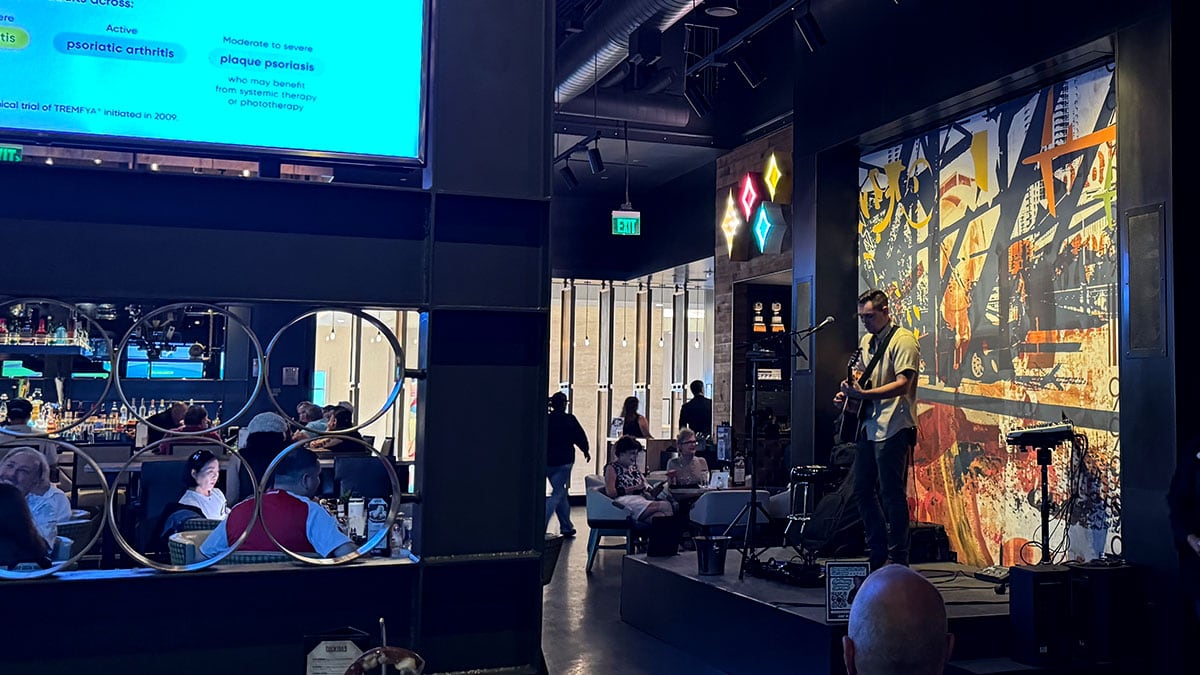 live musician performing at 90 NINETY Bar + Grill on a weekend evening