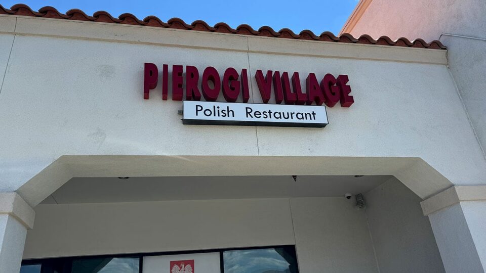 Exterior view of Pierogi Village with the restaurant sign displayed above the entrance.