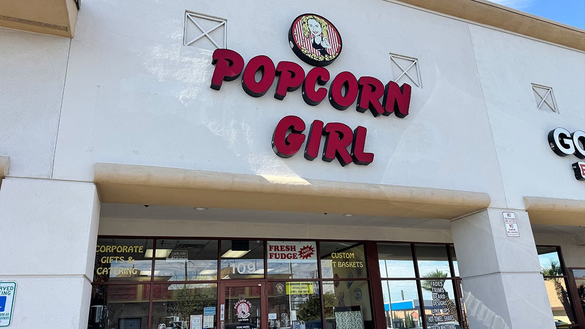 Popcorn Girl store in Las Vegas featuring gourmet popcorn, fudge, and specialty gifts