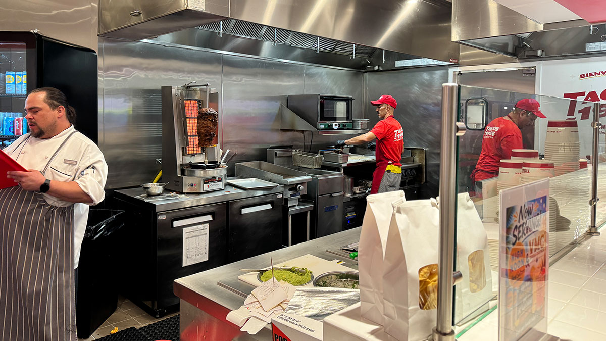 team members preparing fresh Tijuana-style tacos at Tacos 1986