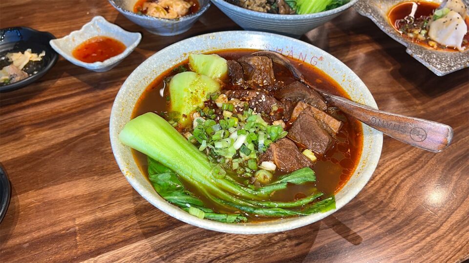 Shang beef noodle with braised beef brisket, vegetables, and green onion at Shang Artisan Noodles.