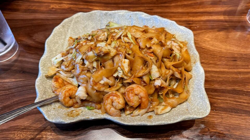 Shrimp chow mein with house-made noodles and vegetables at Shang Artisan Noodles.