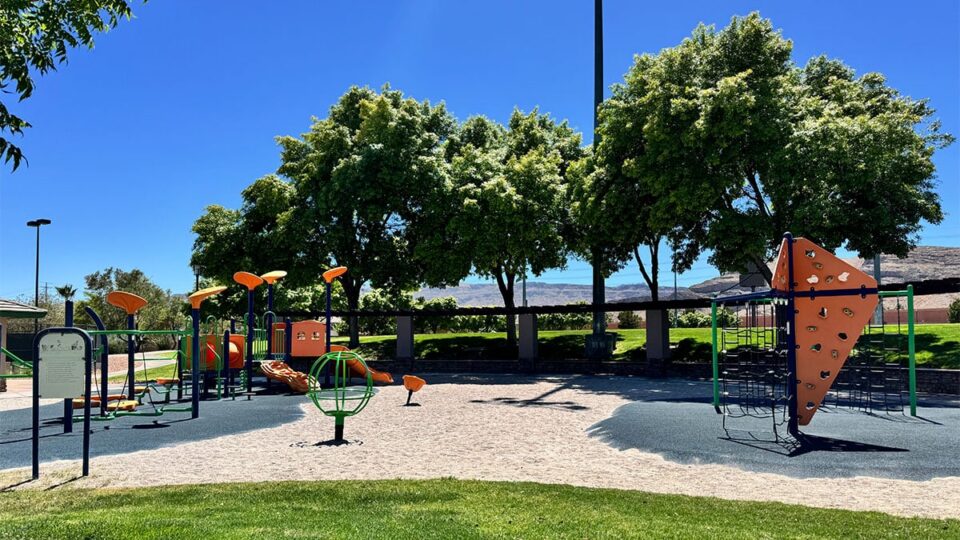 playground area at Spotted Leaf Park featuring play structures and safety surfaces for children