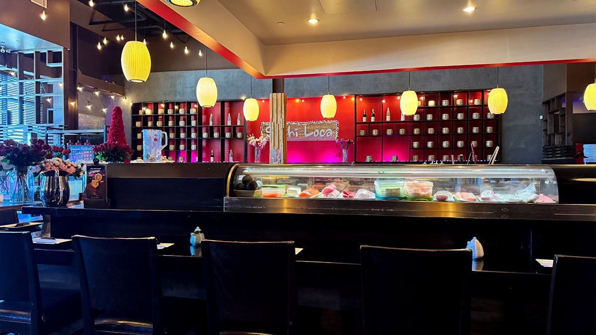 Sushi bar seating where guests can watch chefs prepare fresh sushi rolls.