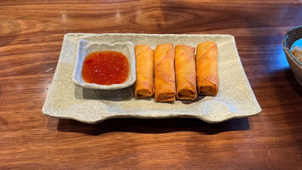 Crispy veggie eggrolls served as an appetizer at Shang Artisan Noodles.