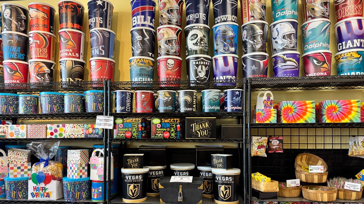 collectible popcorn tins and decorative containers available for purchase at Popcorn Girl