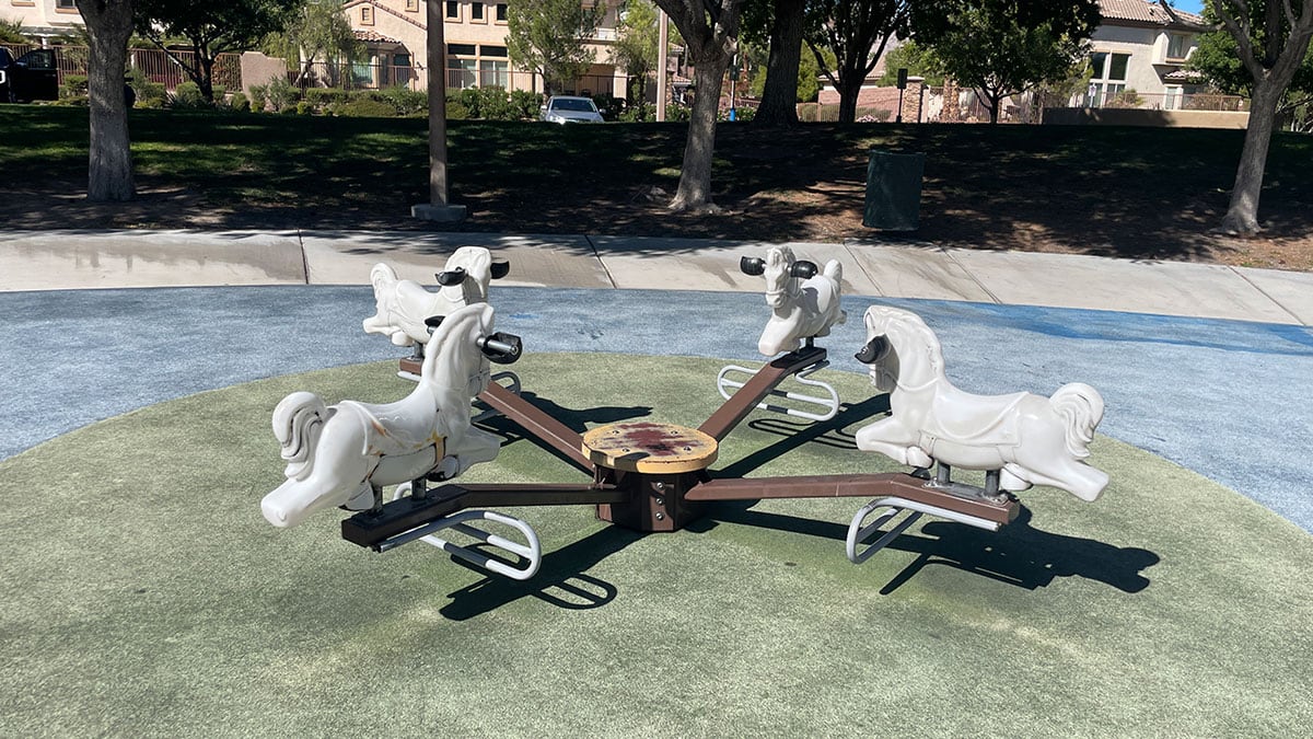 Horse-themed teeter-totter on the toddler playground at South Tower Park.