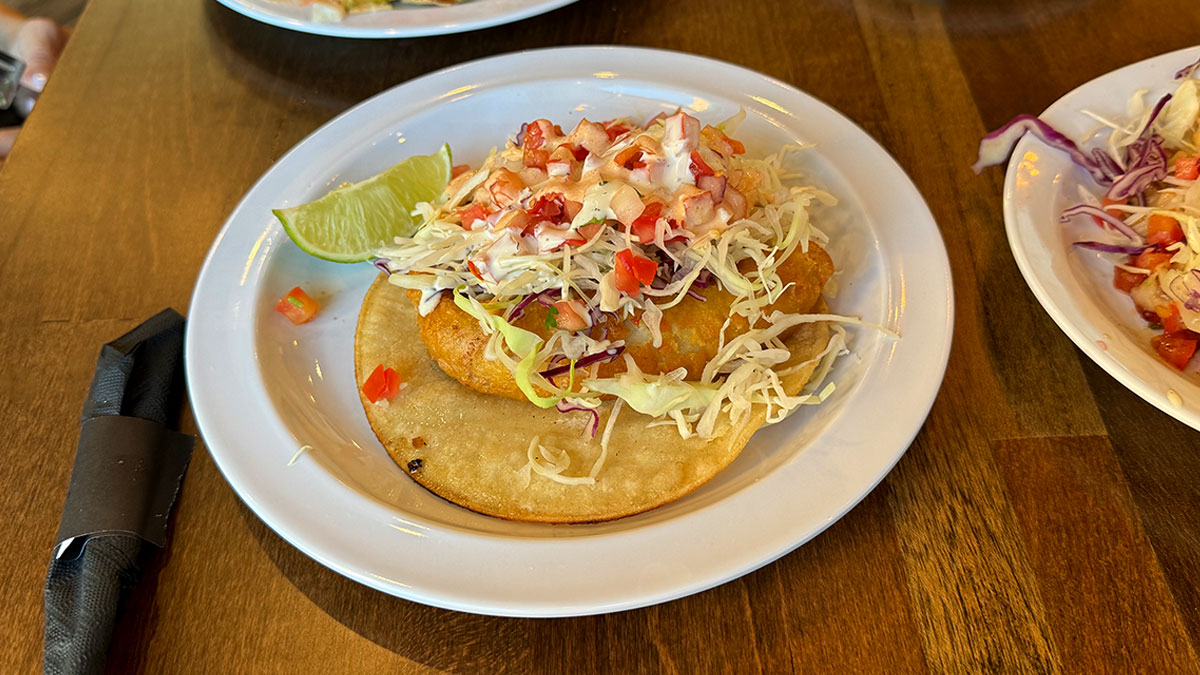 battered Baja-style fish taco topped with cabbage, pico de gallo, and chipotle aioli at Bajamar Seafood & Tacos