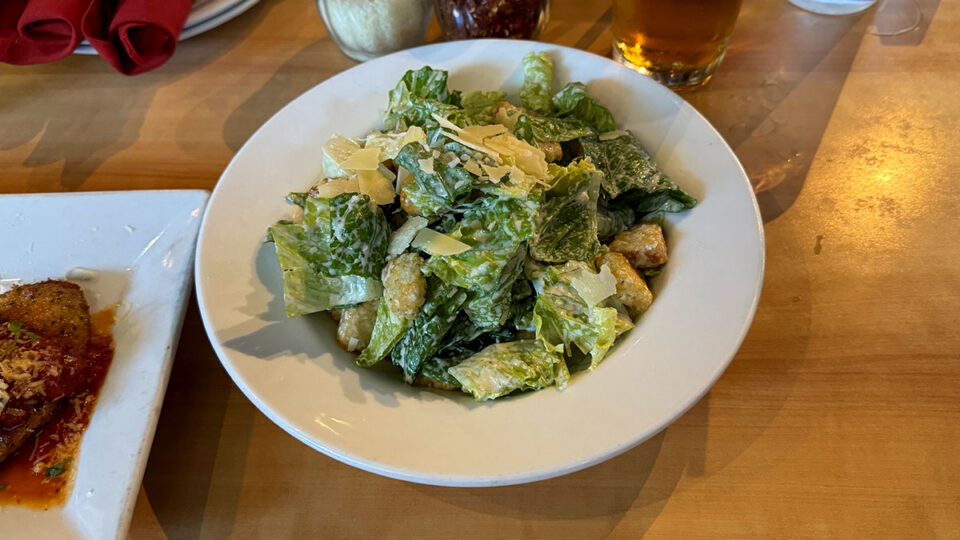 Caesar salad with romaine lettuce, croutons, Grana Padano, and Caesar dressing at Dom DeMarco’s.