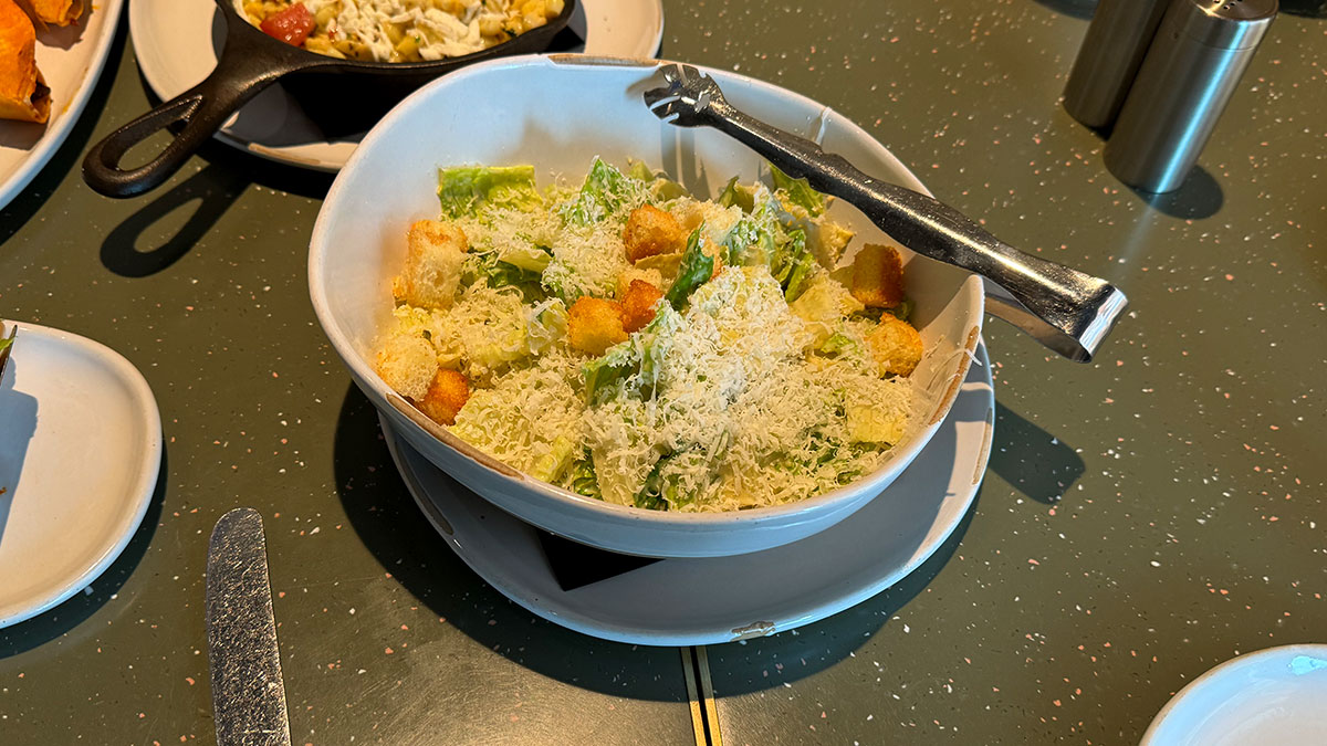 La Madre Caesar salad with petite romaine, brioche croutons, and shaved parmesan