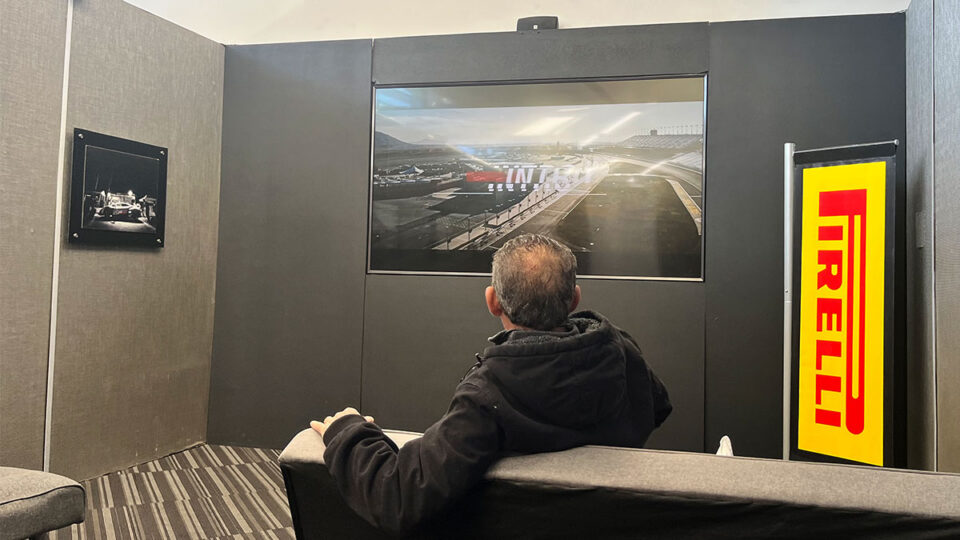 A driver watching the introduction video at Dream Racing