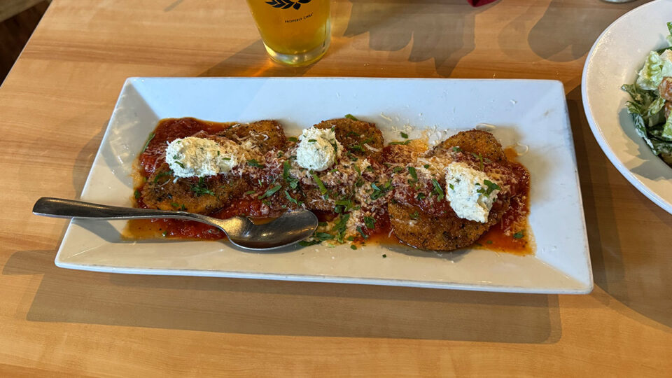 Eggplant Pizzettes topped with herb ricotta, Grana Padano, and marinara at Dom DeMarco’s.