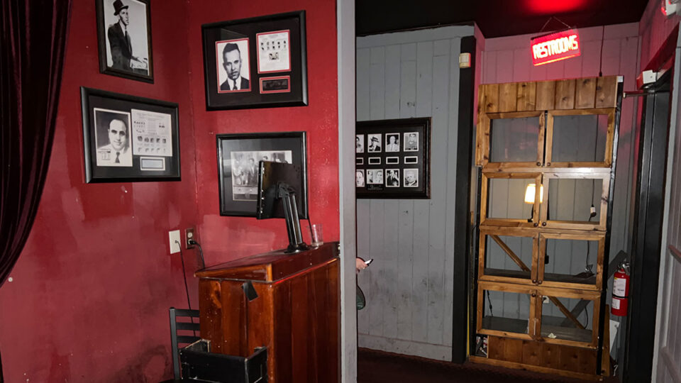 Hidden entrance behind a vintage phone booth leading into Capo's Italian Restaurant and Speakeasy in Las Vegas.