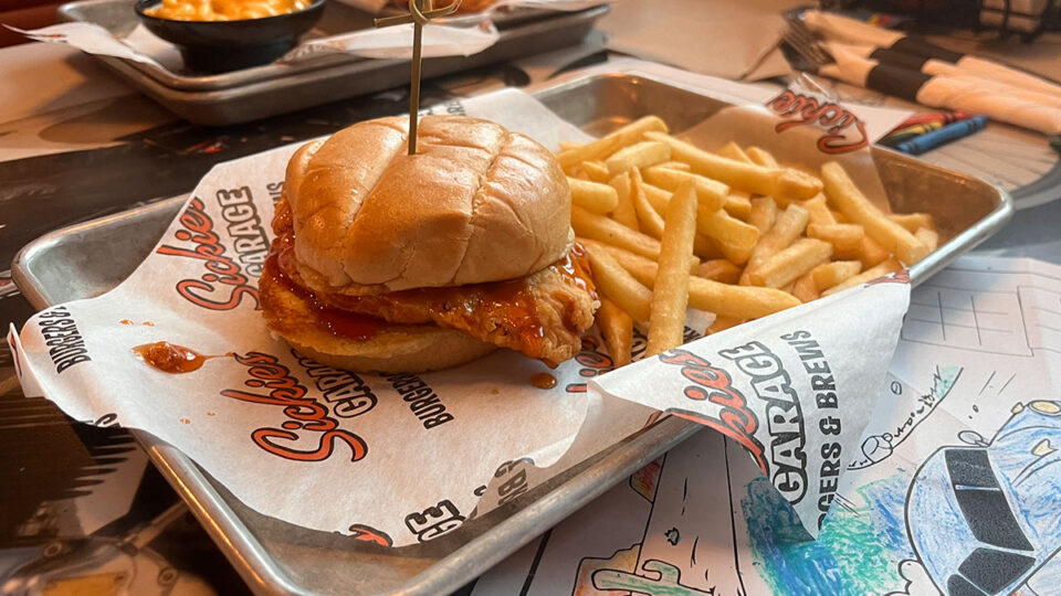 Hot Honey Chicken Sandwich with crispy fried chicken and pickles at Sickies Garage