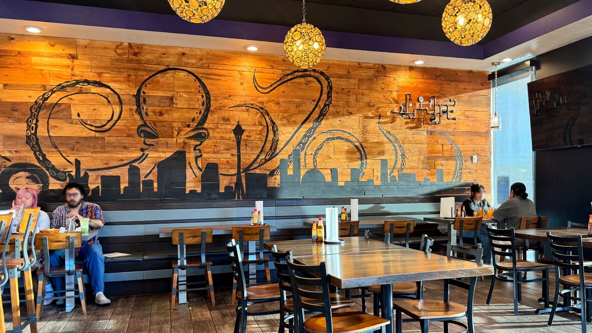 interior dining area of Bajamar Seafood & Tacos Southwest location with casual surf shack décor