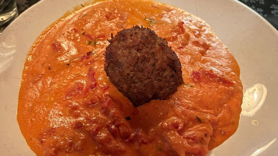 Ma's Meatballs and Peppers appetizer served with homemade Italian meatballs, roasted peppers, marinara sauce, and grated Parmesan at Capo's Italian Restaurant and Speakeasy in Las Vegas.