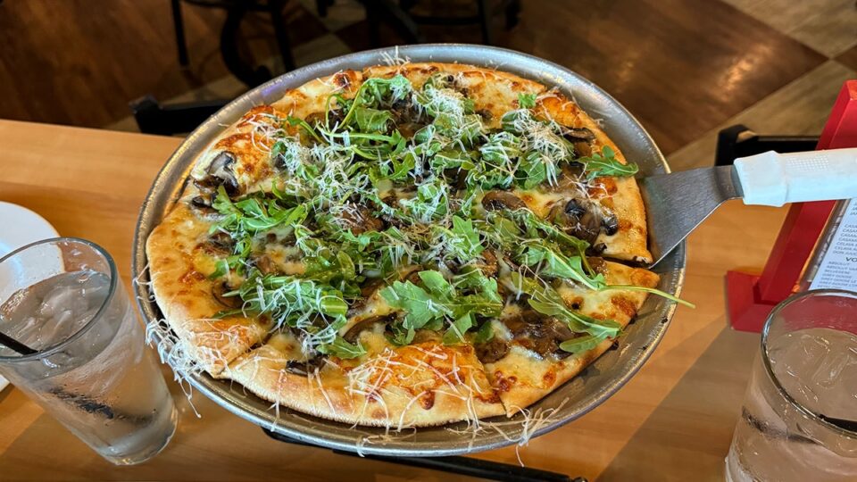 Mushroom White Truffle pizza with fontina, garlic, truffle oil, and arugula at Dom DeMarco’s.