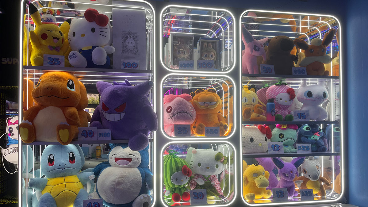 colorful plushies displayed as prizes inside the claw machines at Supa Claw Town Square