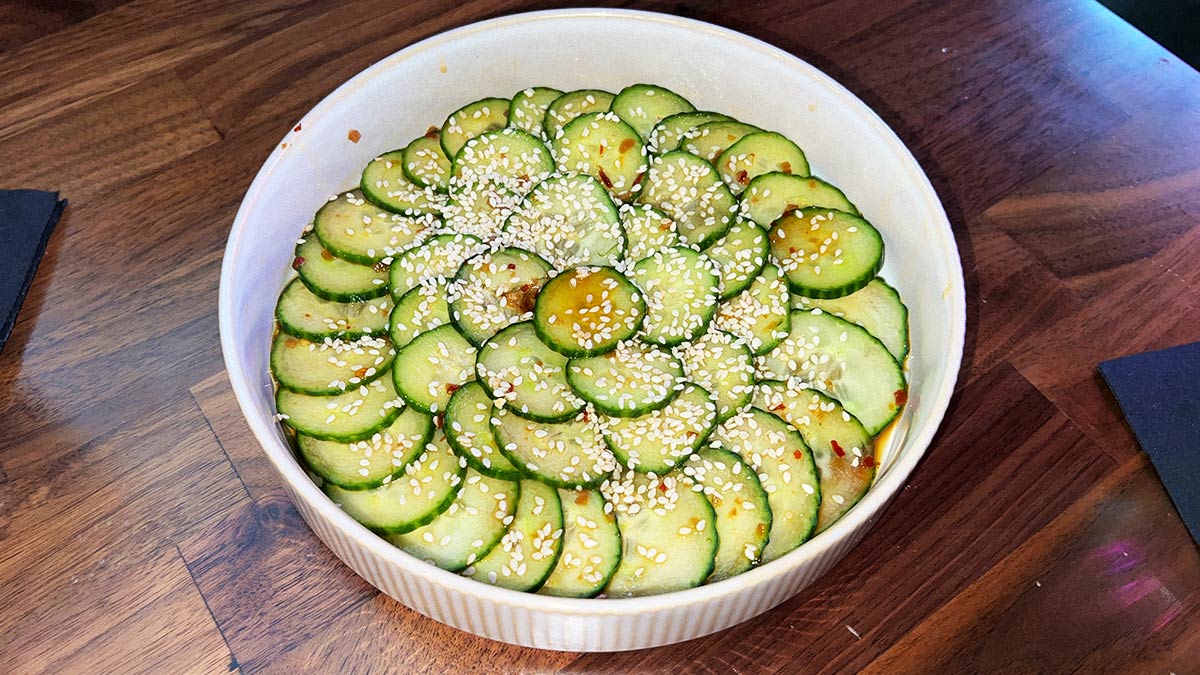 Thinly sliced Japanese cucumber salad with sesame seeds and sesame shoyu vinaigrette.