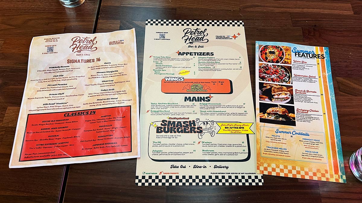 Petrol Head Bar & Grill menus showing cocktails, appetizers, wings, burgers, rice bowls, and seasonal dishes.