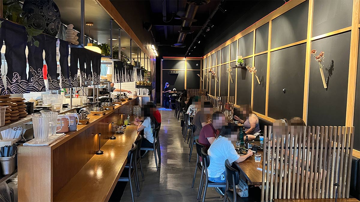 Dining room at Ton Shou Premium Katsu & Izakaya in Las Vegas with tables and counter seating