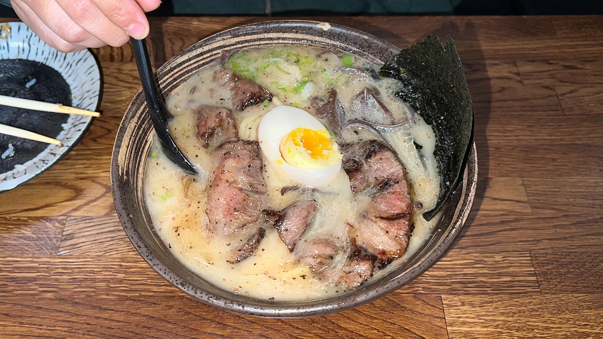 Tonshou Wagyu Ramen with sliced wagyu beef, egg, noodles and seaweed