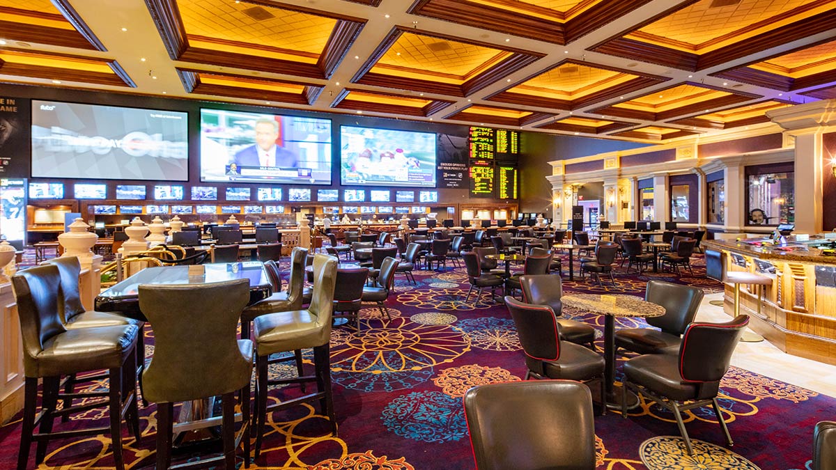 BetMGM Sportsbook at Mandalay Bay with large screens, tables and lounge seating