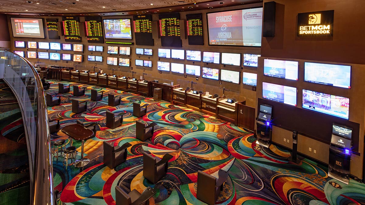 BetMGM Sportsbook at MGM Grand with betting counters, screens and seating