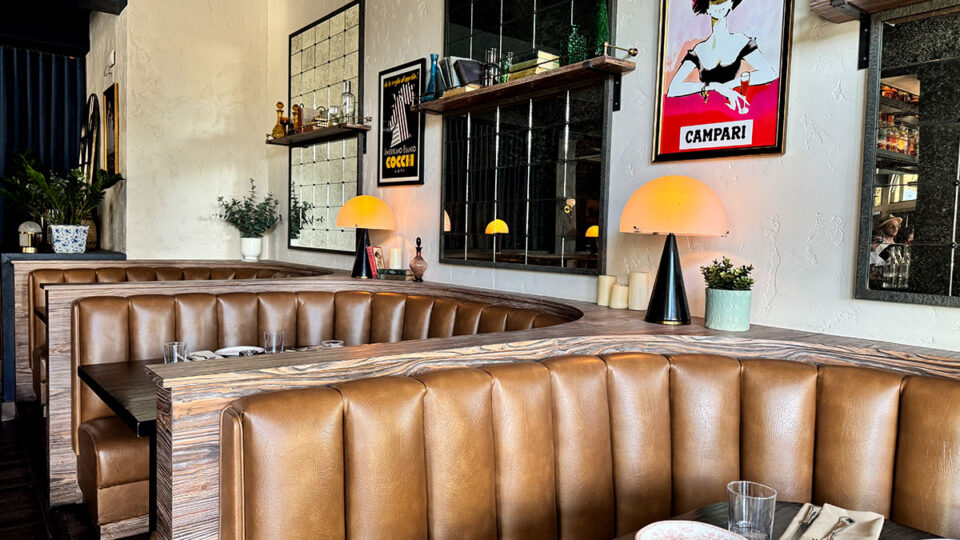 Booth seating and elegant interior decor at Al Solito Posto in Summerlin