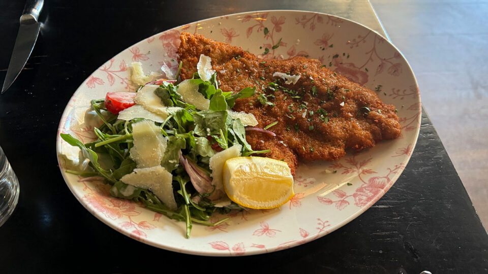 Veal Milanese with arugula, tomato, Parmesan, and lemon at Al Solito Posto