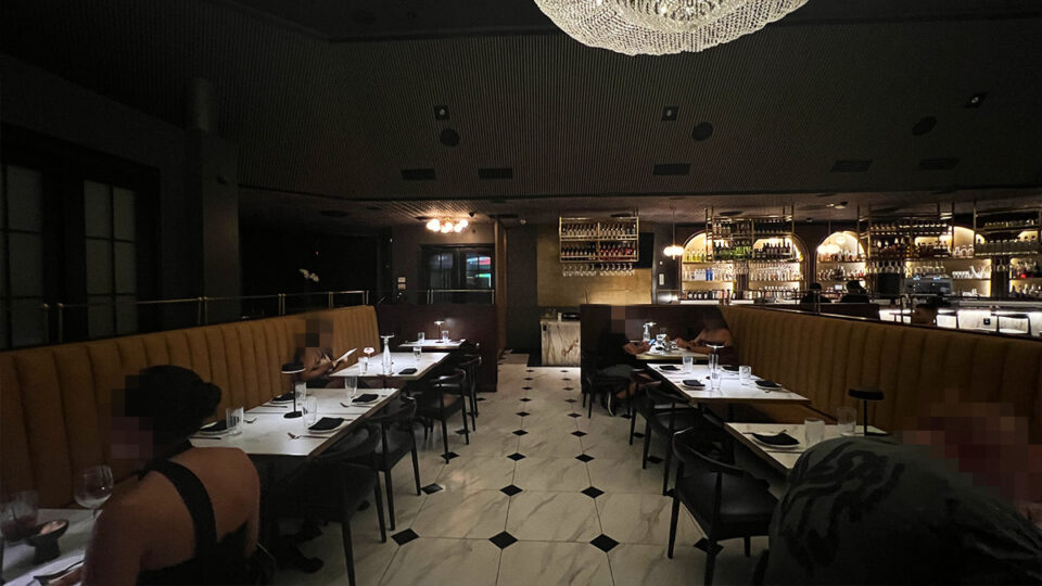 Interior dining room at Braseria by EDO in Las Vegas with booths, tables and bar seating