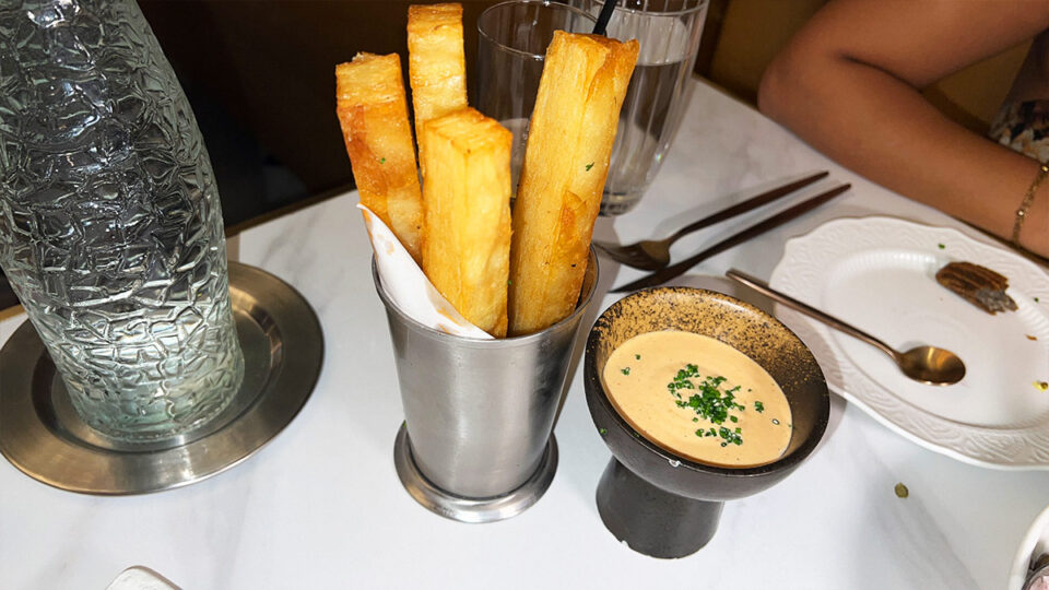 Crispy layered patatas bravas with traditional bravas sauce at Braseria by EDO