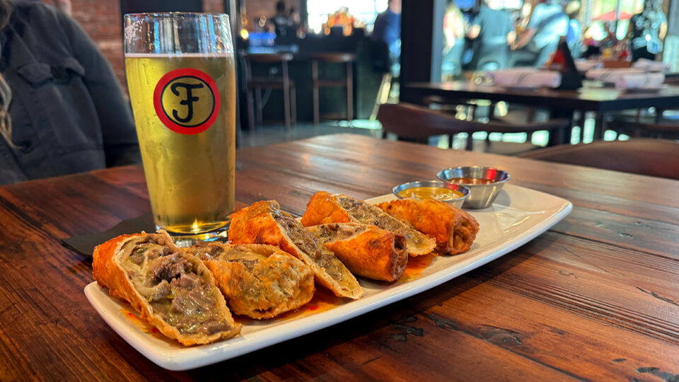Cheesesteak Egg Rolls appetizer with prime rib, peppers, onions and cheese at Finney's Crafthouse