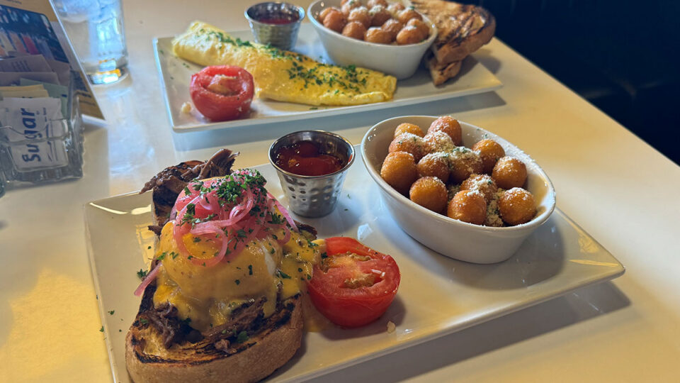 Short Rib Benny and Classic French Omelet served with parmesan truffle potatoes at Toasted Gastrobrunch.